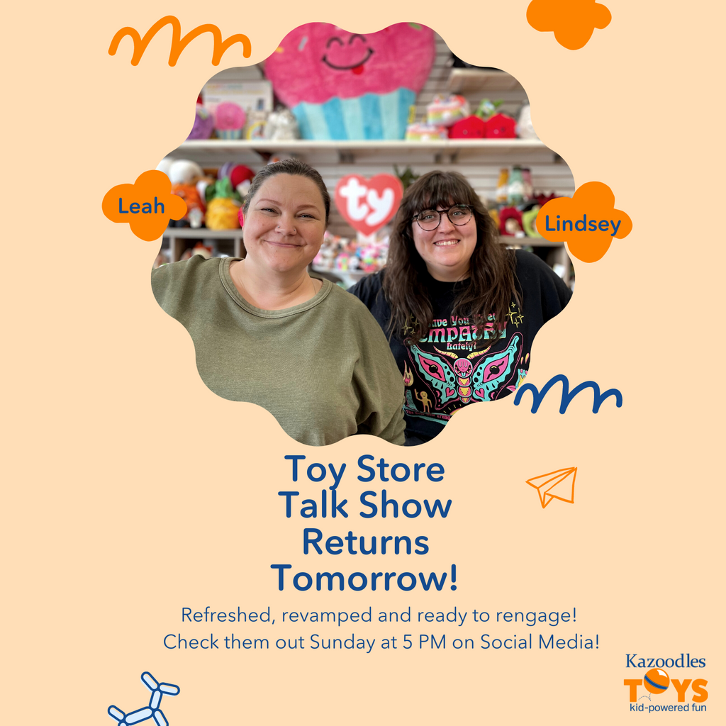 two women smiling standing in a toy store